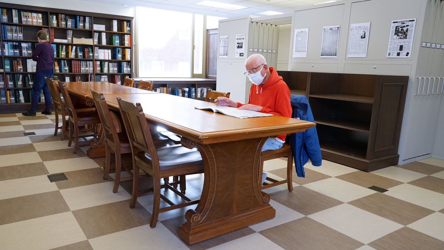 Periodicals Department - room view with people browsing bookshelves and newspapers