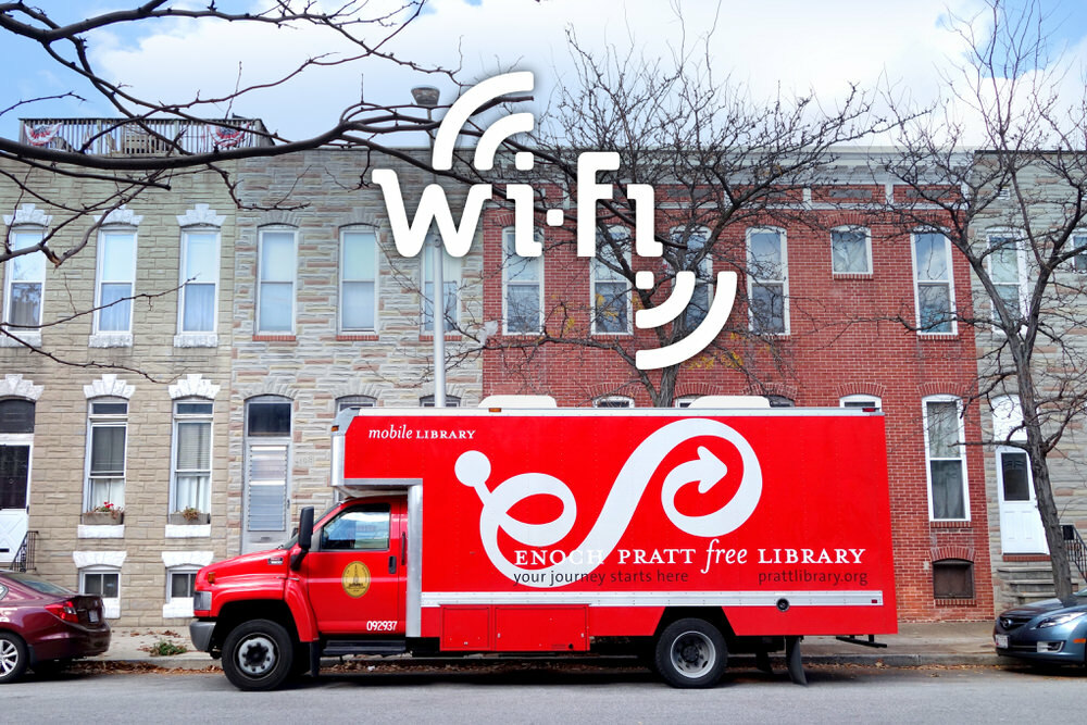 Community Wi Fi - Pratt Bookmobile on a Baltimore street, with Wi-Fi hotpsot logo