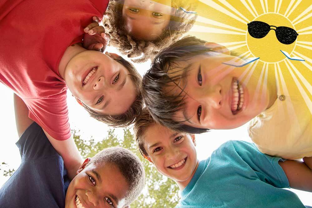 Summer Break Baltimore events for Kids - a group of happy children with heads togetehr from below, with logo in the corner