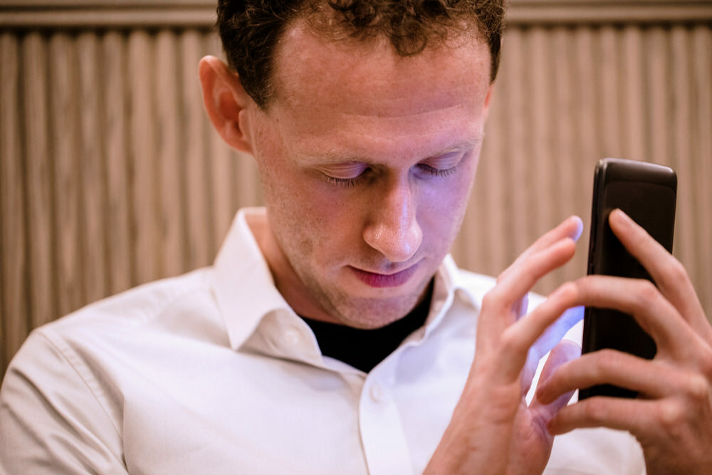 accessibility - blind man using mobile phone