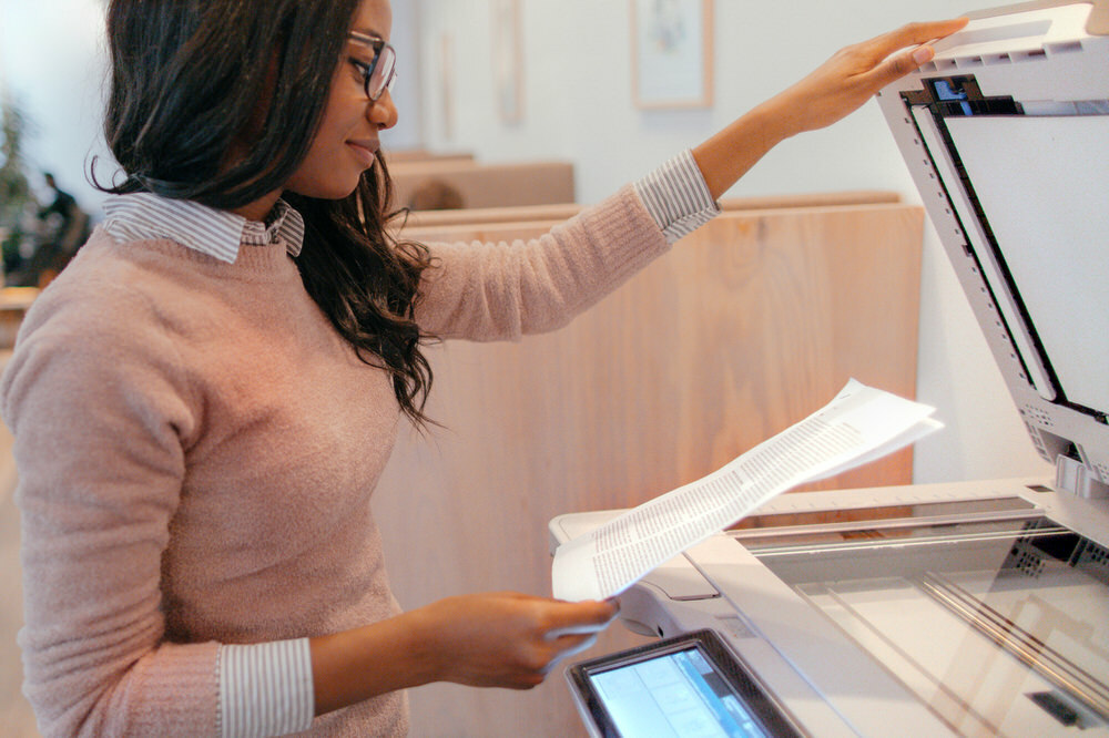 woman using a copier, printer, or fax machine