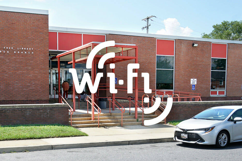 Drive-In Wi-Fi - car parked outside a librray building