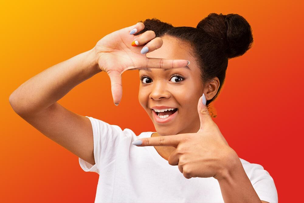 teen girl framing a scene with her hands