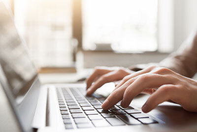 Hands on laptop partner borrowing