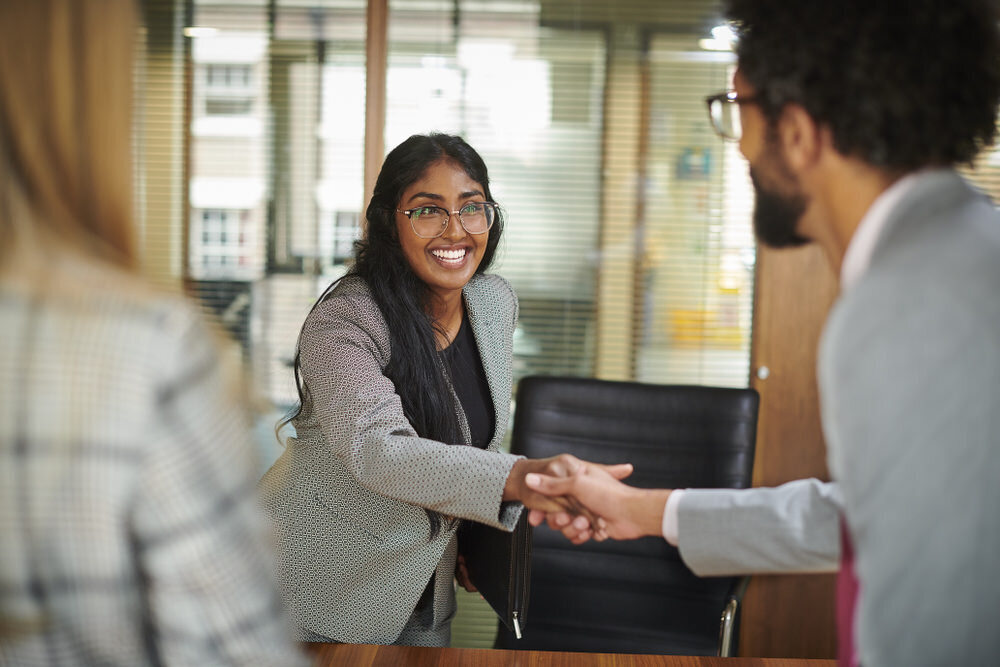 job workplace handshake and smile