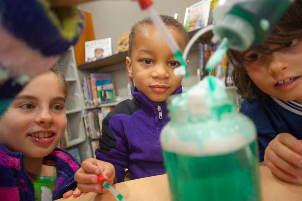 kids doing a STEAM activity with chemistry