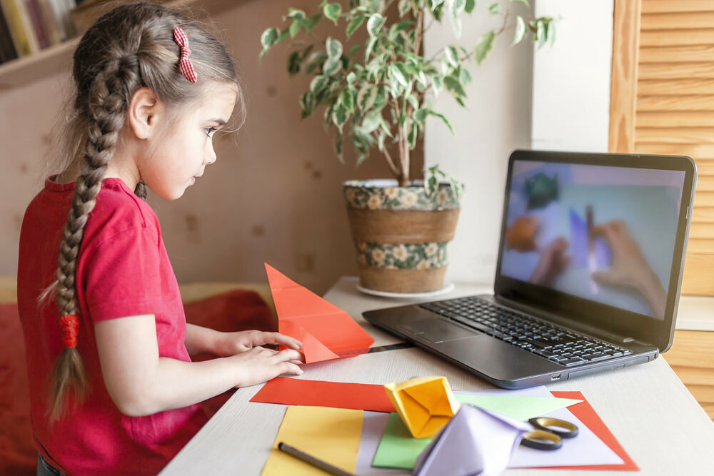 after school activities for kids - girl learning origami online
