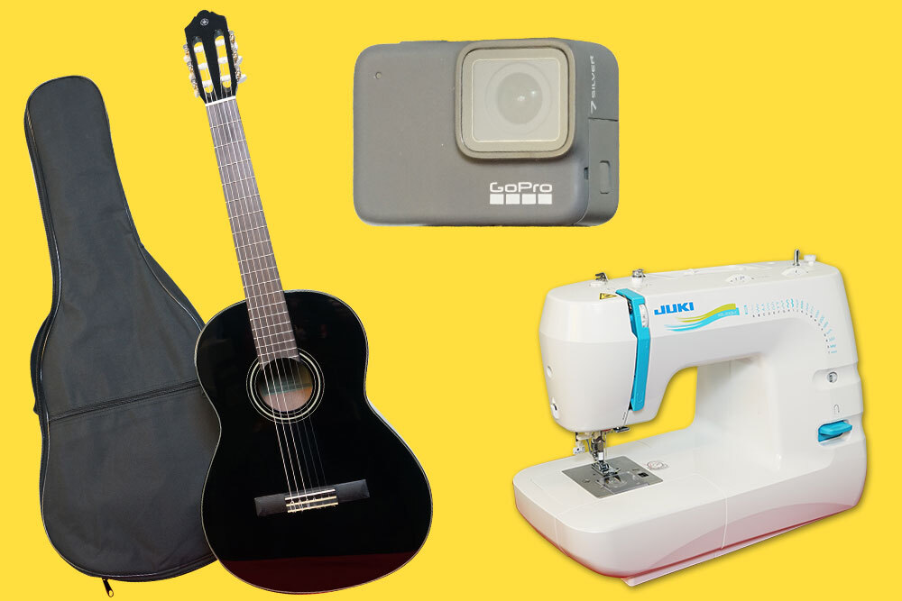 Teen library of things - GoPro camera, guitar, and sewing machine on yellow