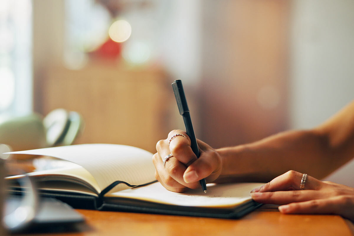 writing in a notebook