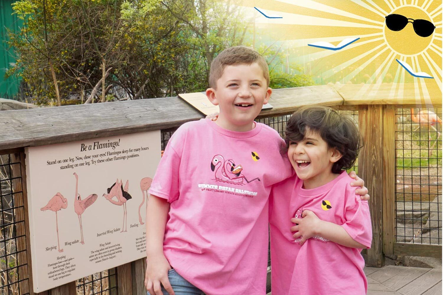 Summer Break Baltimore kids in their 2025 t-shirts by flamingoes at the zoo