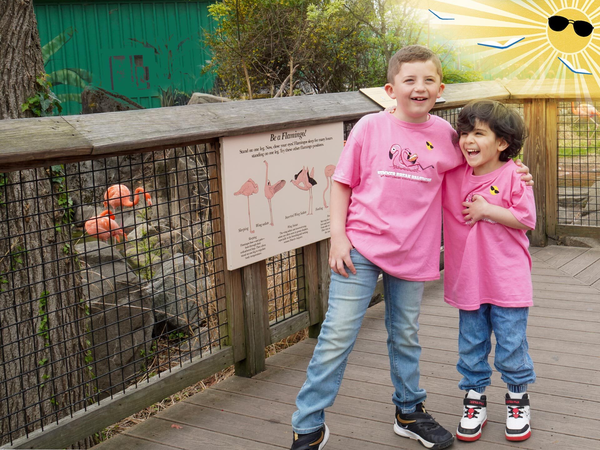 Summer Break Baltimore kids in their 2025 t-shirts by flamingoes at the zoo