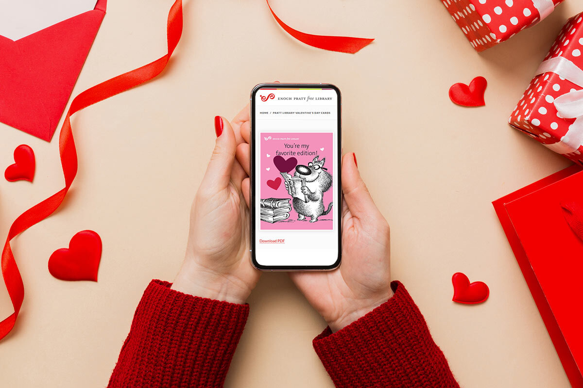 printable Valentines on a phone with hands and a gift table