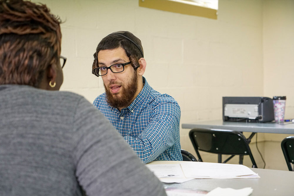 Lawyer in the Library speaking with a customer