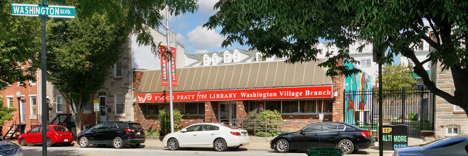 Washington Village Branch exterior - street view with cars and signs
