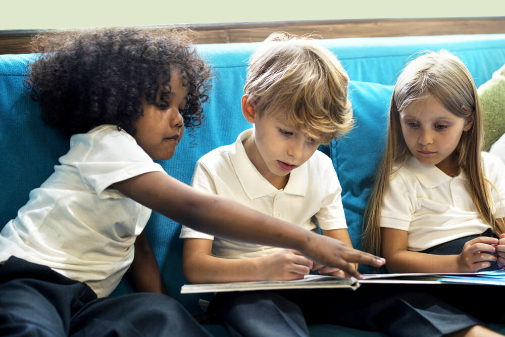 diverse children reading together