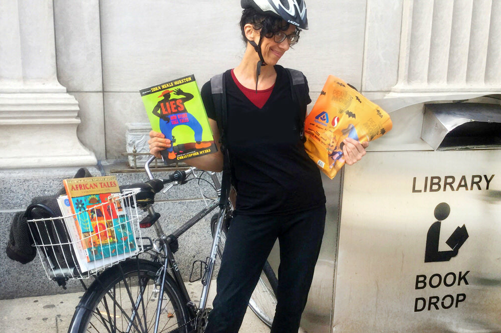 returning books by bike using a Pratt Library book drop