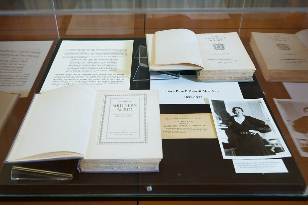 Mencken Room display case with books and a photo of his wife Sara