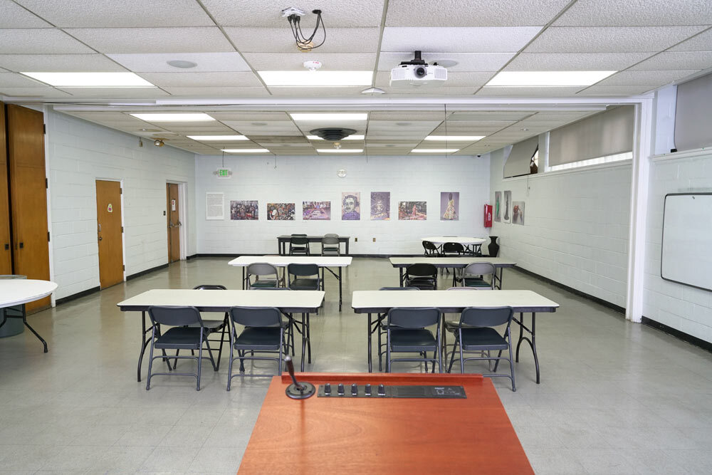 Pennsylvania Avenue meeting room - tables, chairs, lectern view