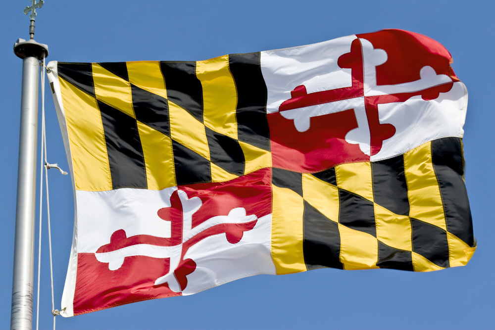 Maryland flag closeup on a blue sky