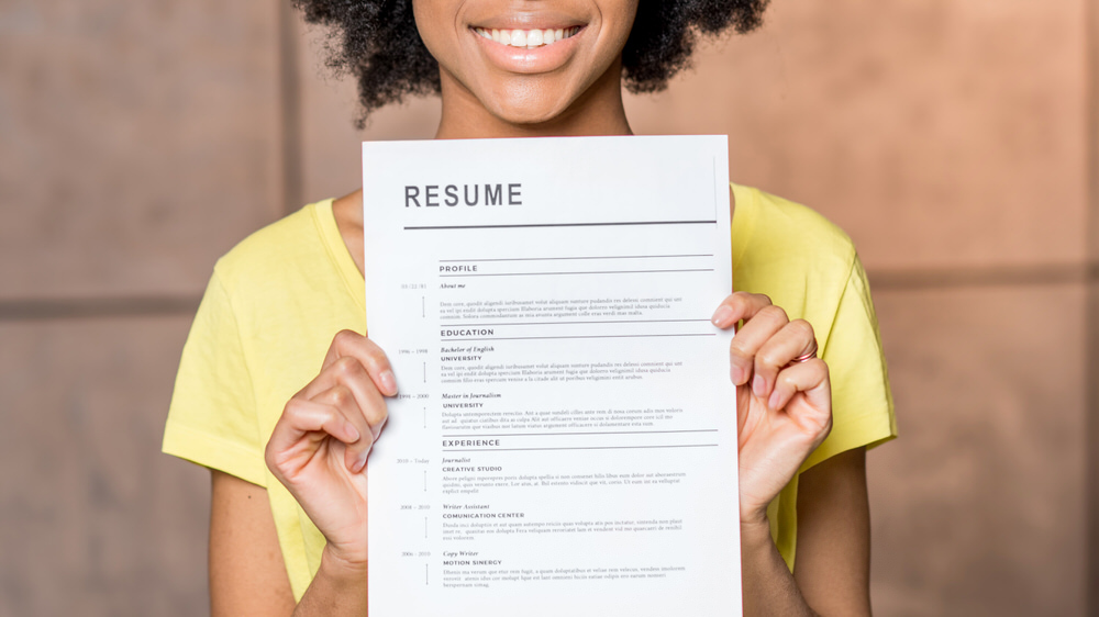 woman holding her new resume