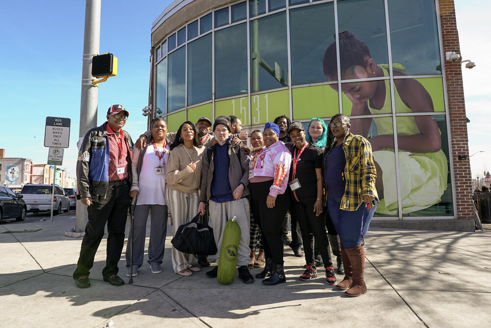 Peer Navigators outside the Pennsylvania Avenue Branch library in Penn North