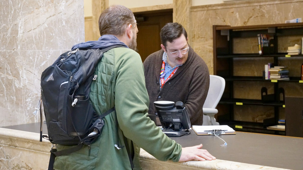 librarian helping a customer