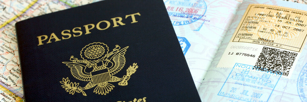 U.S. Passport with travel stamps on a map