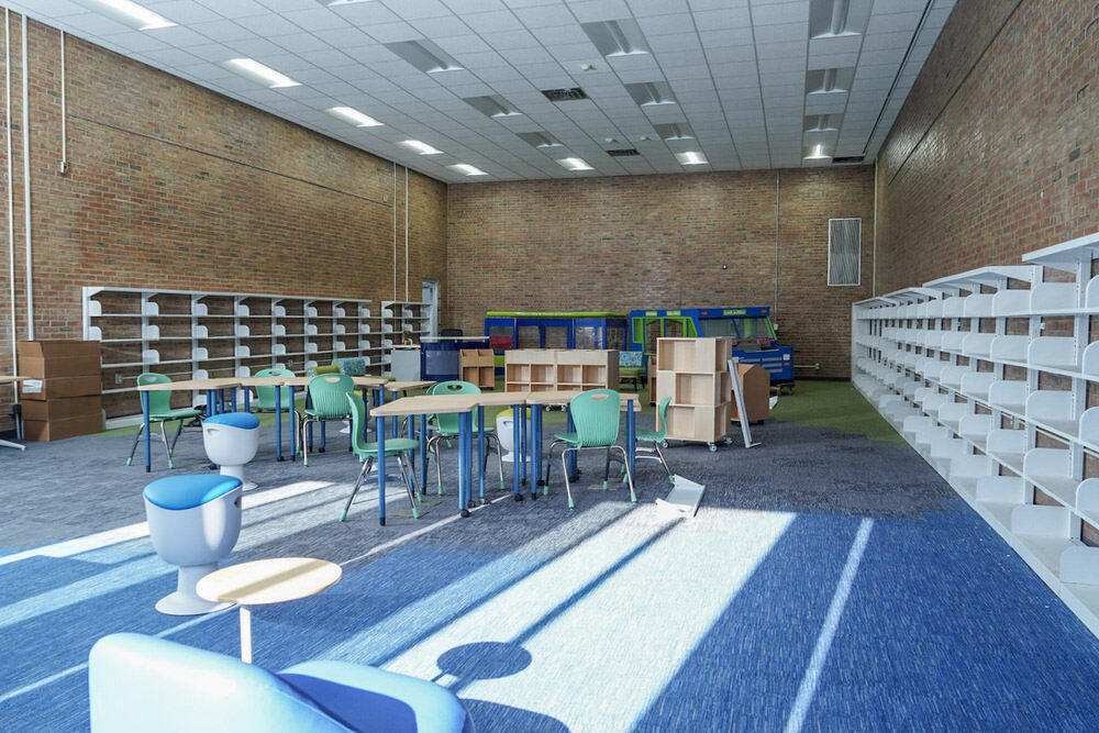 Brooklyn branch renovations, showing empty bookshelves and window light on new carpets, fall 2025