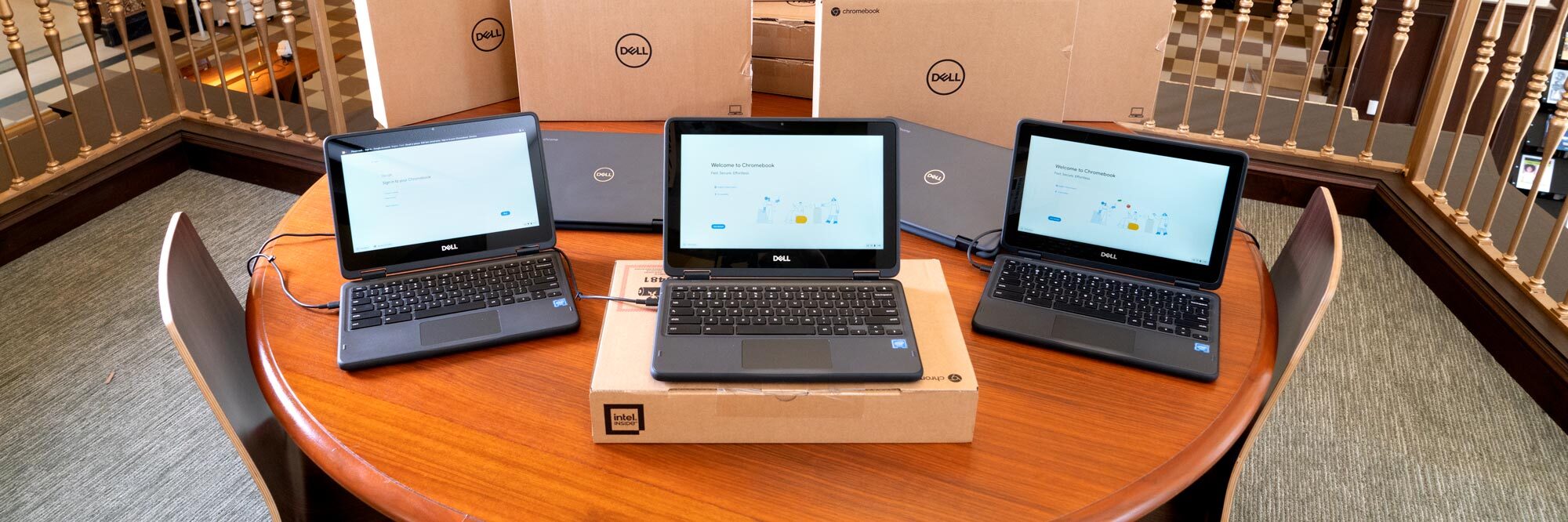 Dell Chromebooks - 3 open laptops on a round table