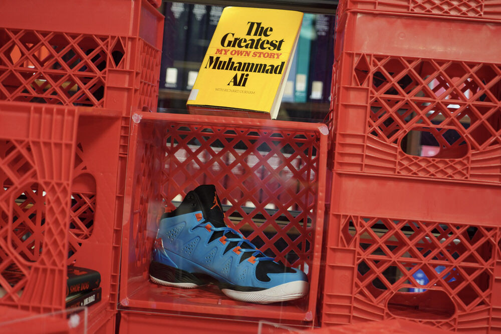 House of Melo exhibit at Pratt Library - milk crates with show and book