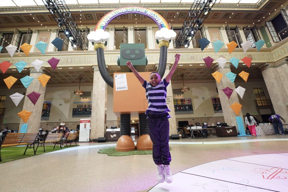 Imagination Celebration 2025 robot and jumping boy