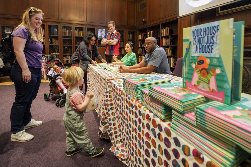 Imagination Celebration 2025 - young child approaching the authors table