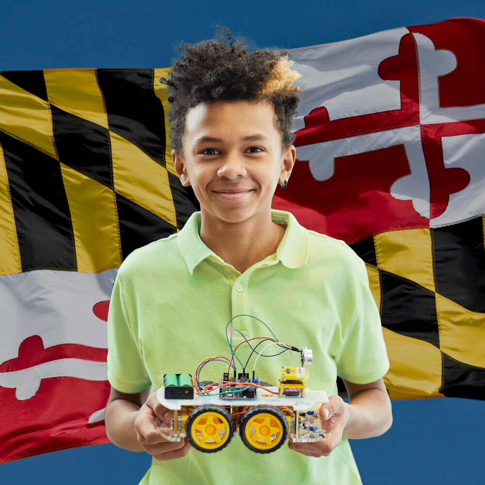MD STEM Fest boy with robotic creation and MD flag