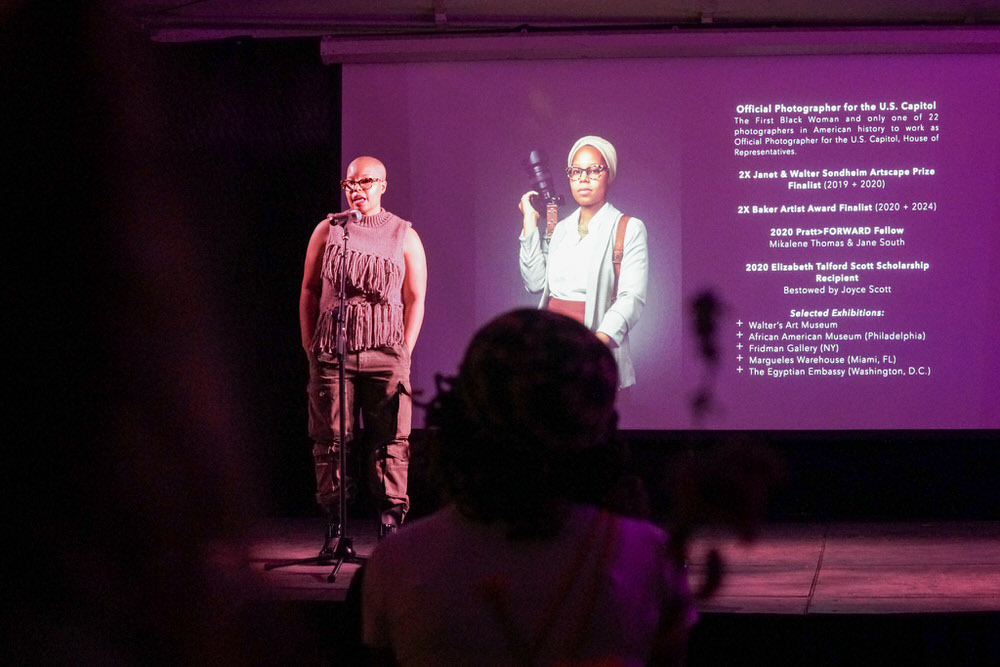 Phylicia Ghee talk at Current Space with screen presentation in the background