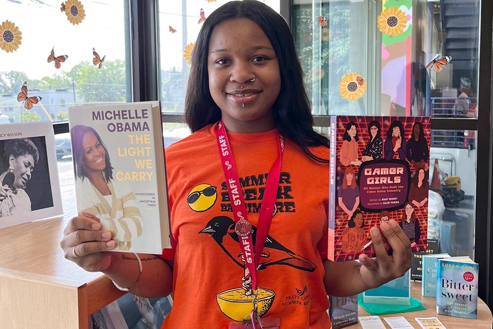 Summer Break Baltimore 2023 photo - ==staff member with free books