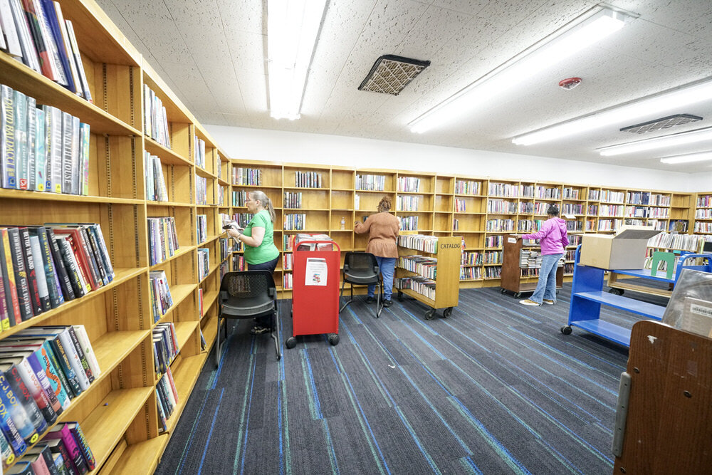 Walbrook building renovations - books being reshelved by staff