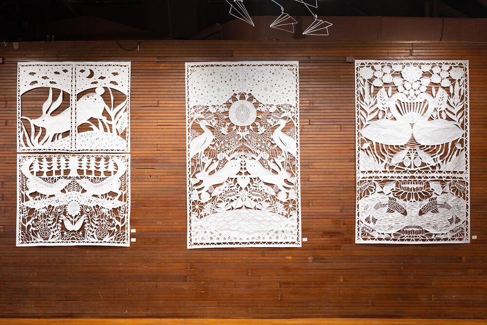 paper cut art by Artist writer in residence Annie Howe - 3 large works on wall