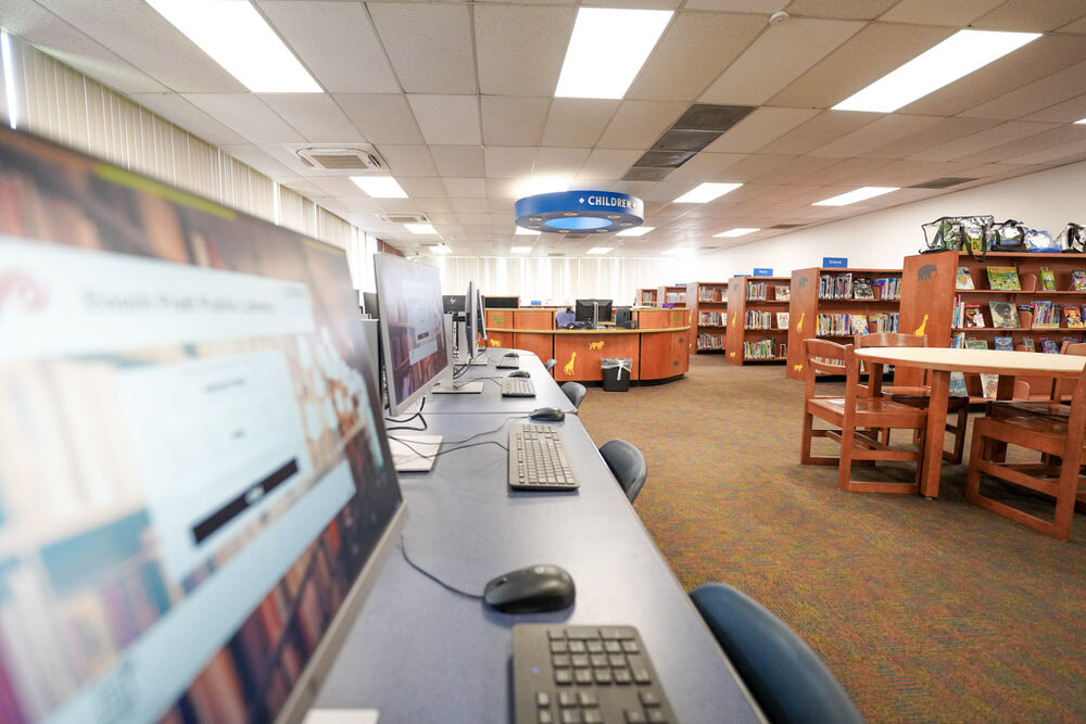 computers, keyboard, mouse and seating at a Pratt Library branch
