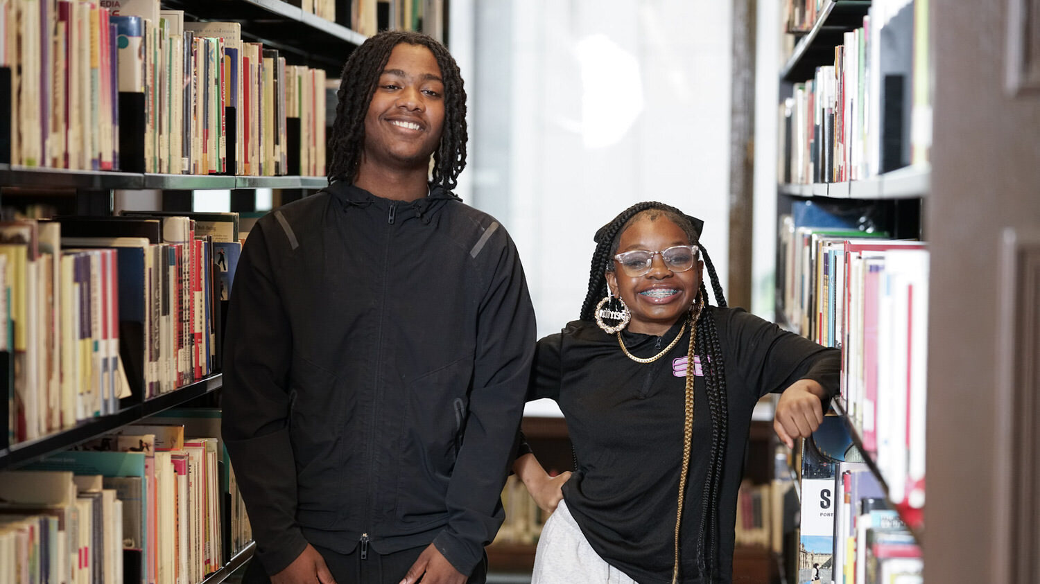 two teens smiling at a Pratt Library program