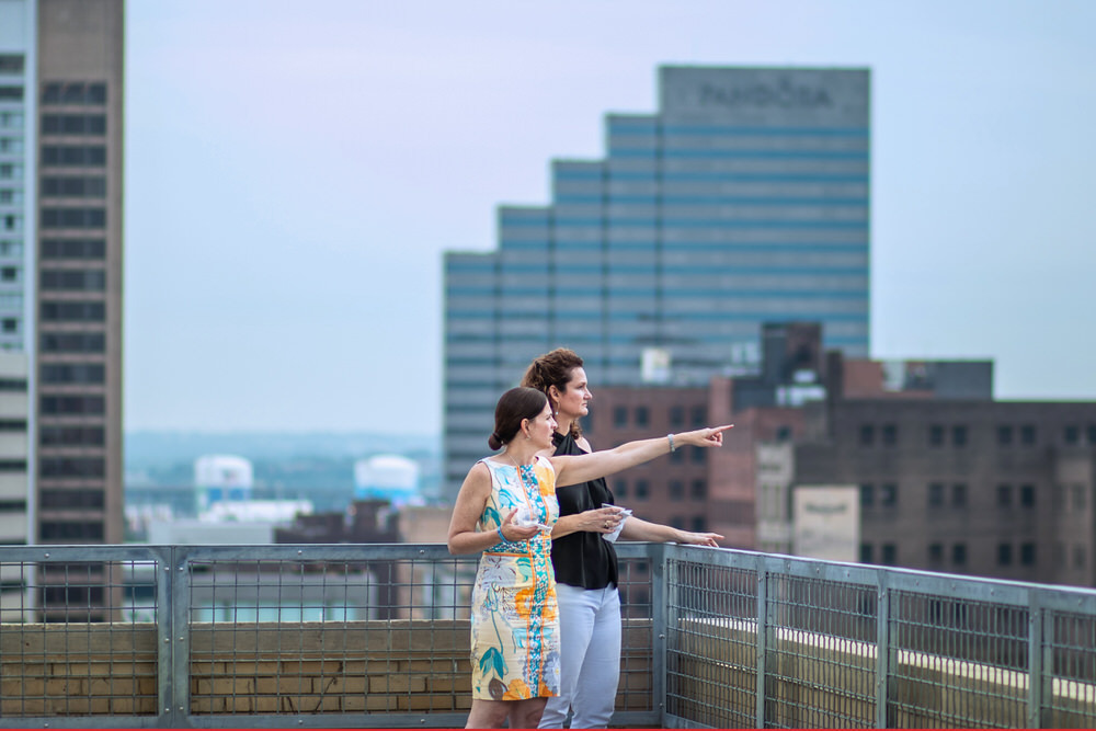 Pratt Insiders overlooking the city at a private rooftop event