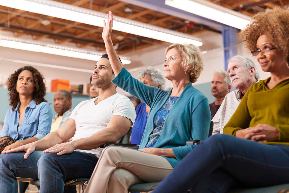 raised hand in the advisory group audience