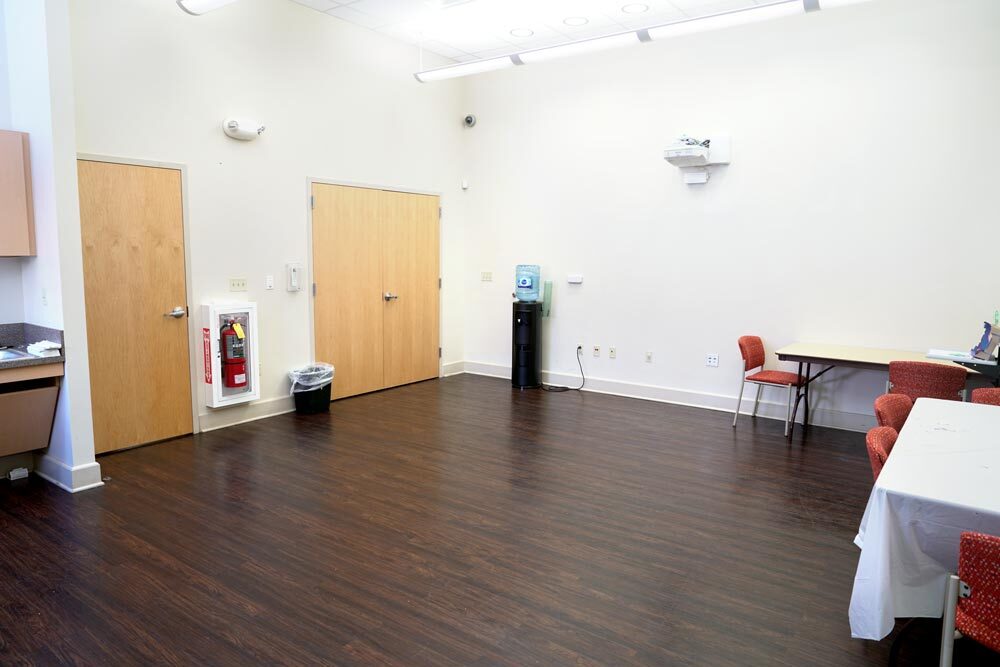 Canton meeting room showing doors and water fountain