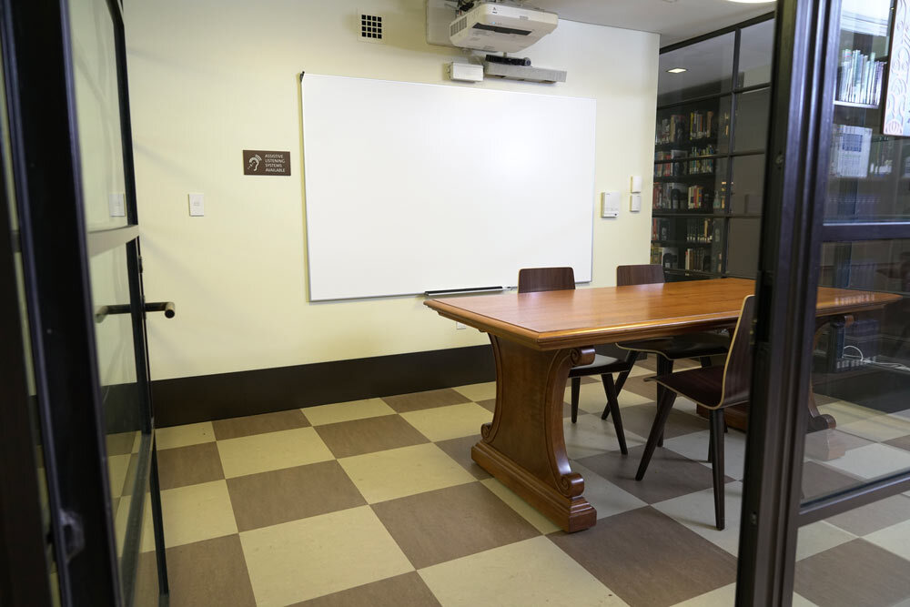 meeting room 1804 at the Central Library - a table, chairs, a checkerboard floor, and glass walls from the entrance