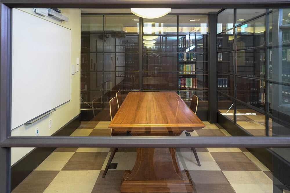 meeting room 1804 at the Central Library - a table, chairs, a checkerboard floor, and glass walls seen from the outside