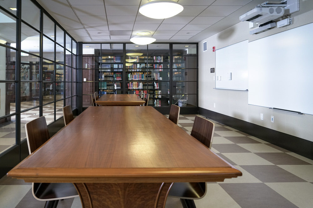 meeting room 1802 at the Central Library - glass walls,  long tables, chairs, and whiteboards