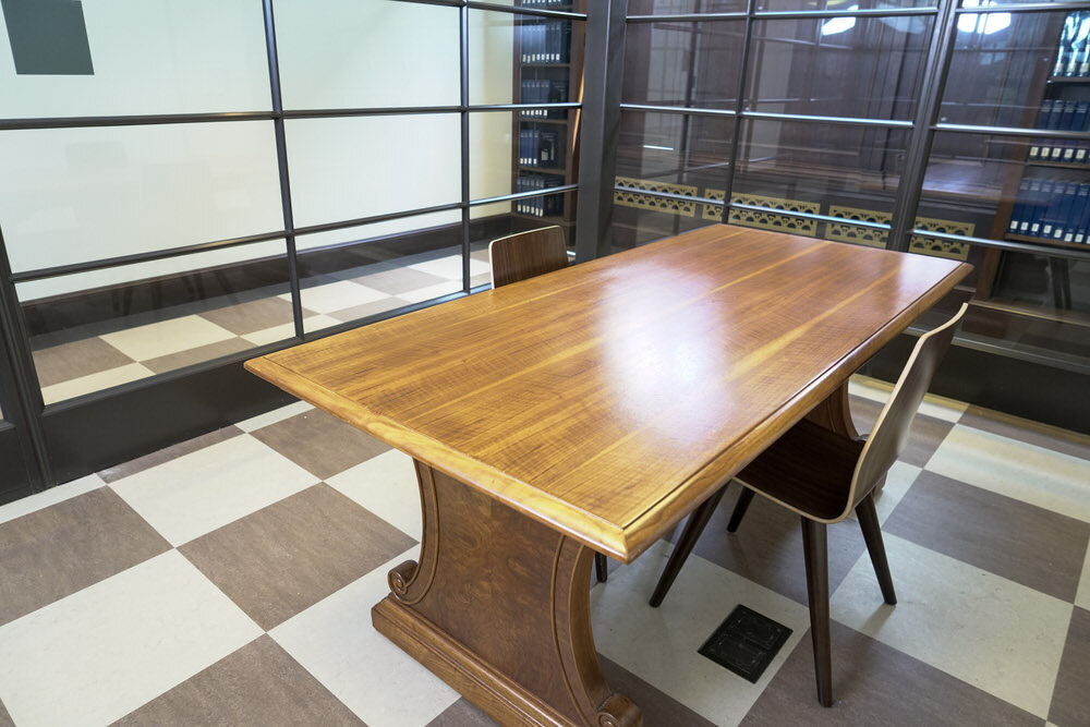 meeting room 1803 at the Central Library - a table, chairs, a checkerboard floor, and glass walls