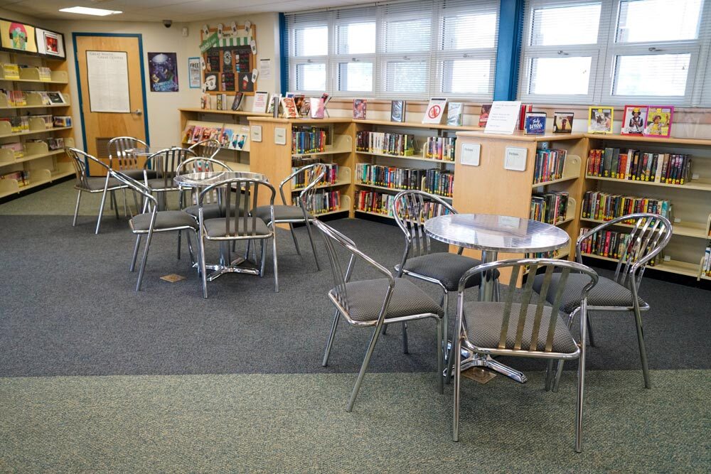 Edmondson Avenue - a corner with tables and chairs by the windows