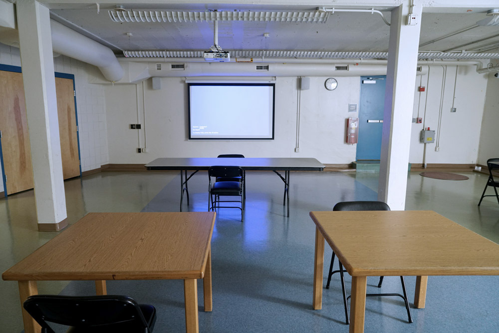 Edmondson Avenue Meeting Room - projection screen, tables, chairs