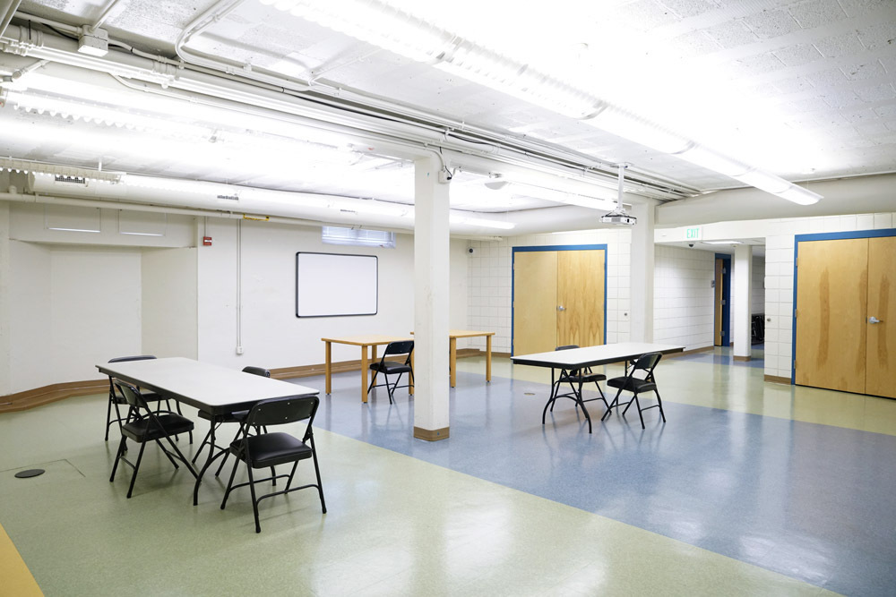 Edmondson Avenue Meeting Room- tables and chairs, whiteboard and storage closets