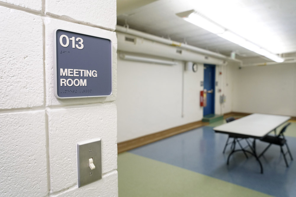 Edmondson Avenue Meeting Room - room entrance with braille sign and light switch